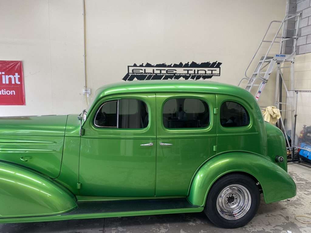 green hot rod with tinted windows